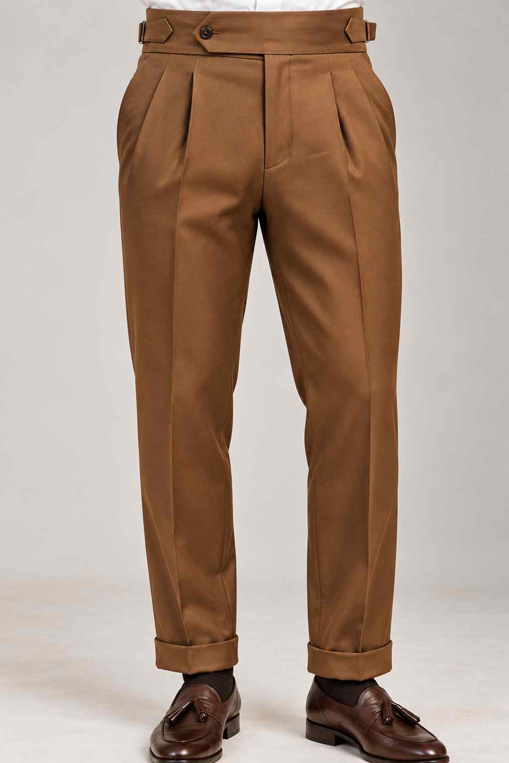 Men’s brown Gurkha style trousers with high waist, double pleats, adjustable waistband and cuffed hems