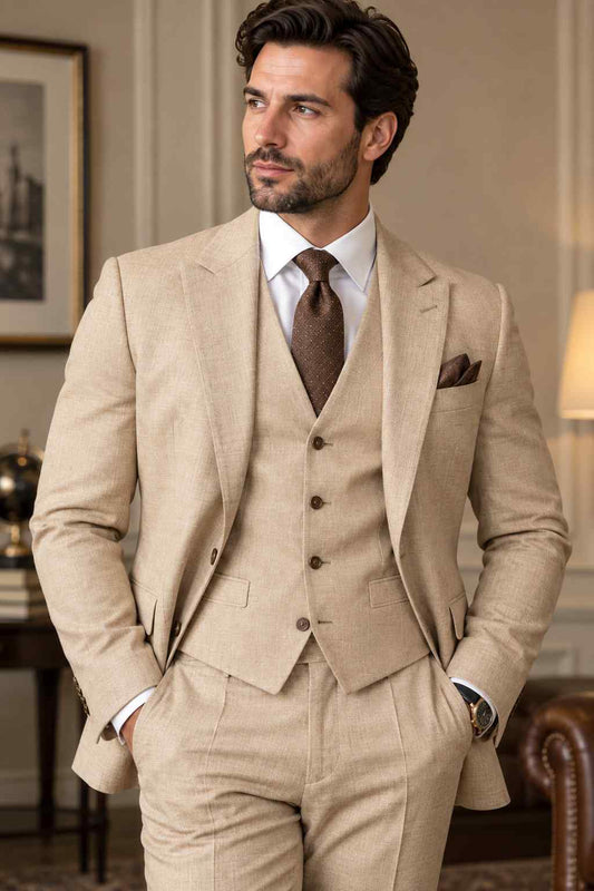 Men’s beige linen 3-piece suit featuring a peak lapel jacket, matching waistcoat, tailored trousers, white shirt and brown tie.