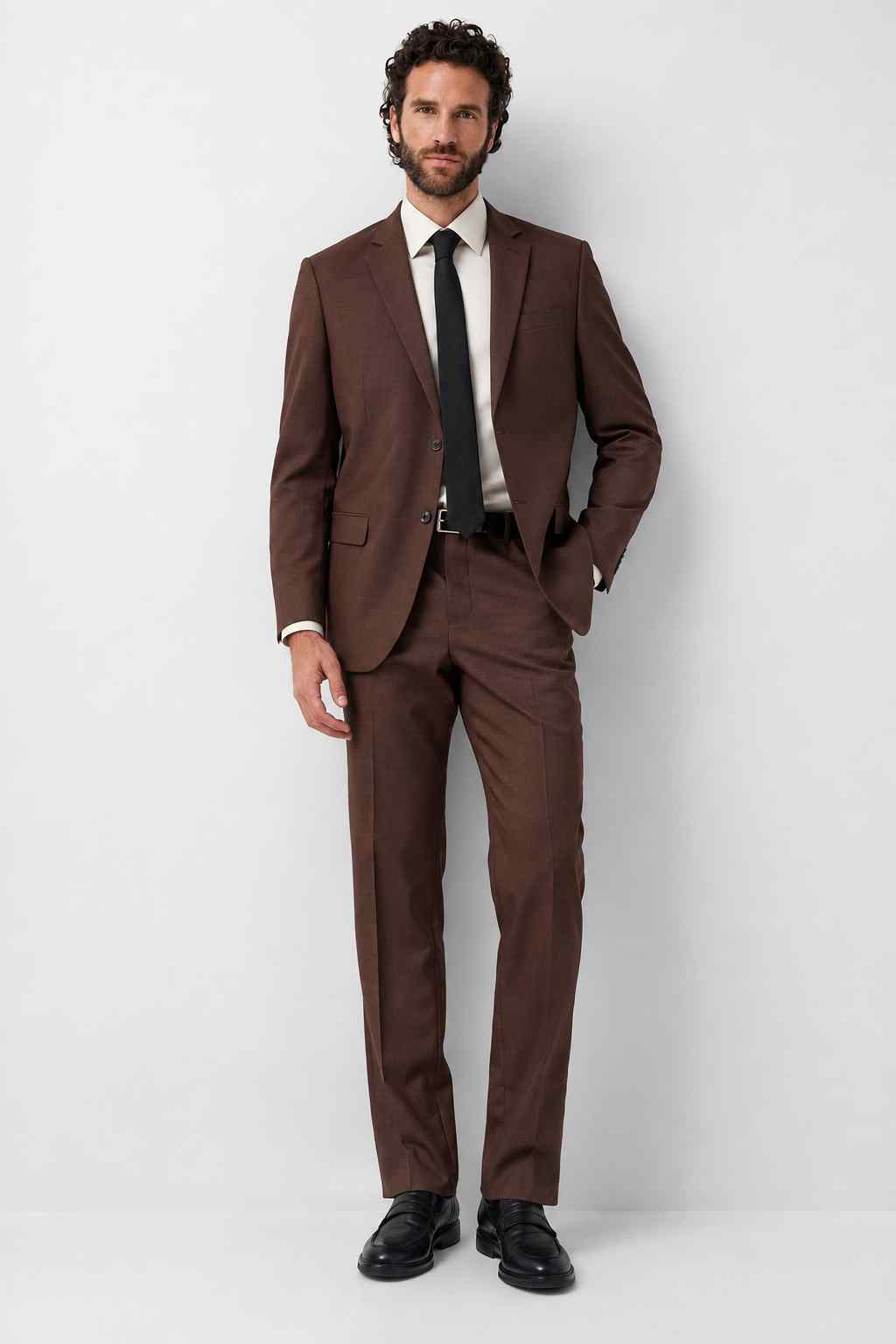 Men’s brown 2-piece tailored suit with notch lapel, two-button jacket, matching trousers, and formal business wedding style.