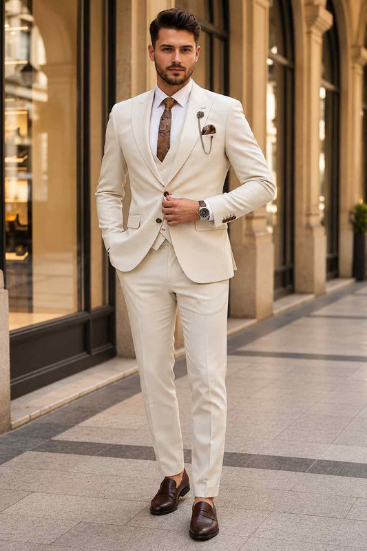 Men’s beige 3-piece suit with peak lapel jacket, matching waistcoat, tailored trousers, white shirt and patterned brown tie.