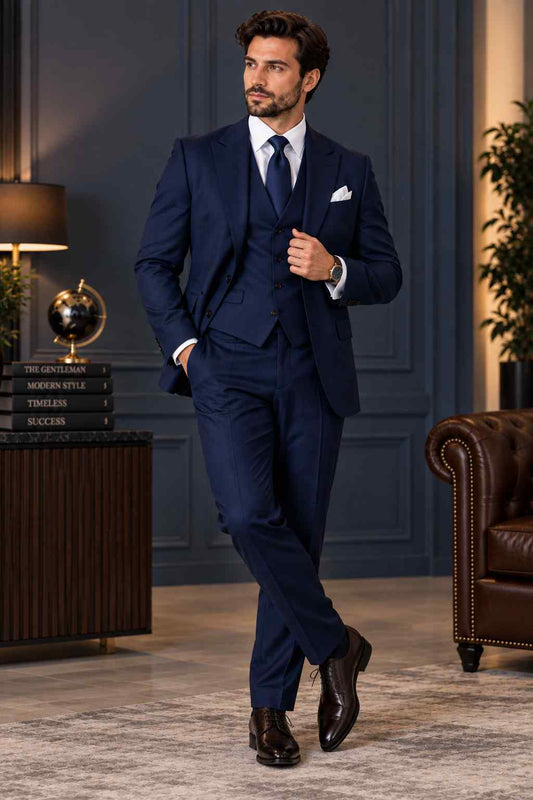 Men’s navy blue 3-piece suit with notch lapel jacket, matching waistcoat, tailored trousers, white shirt and navy tie.