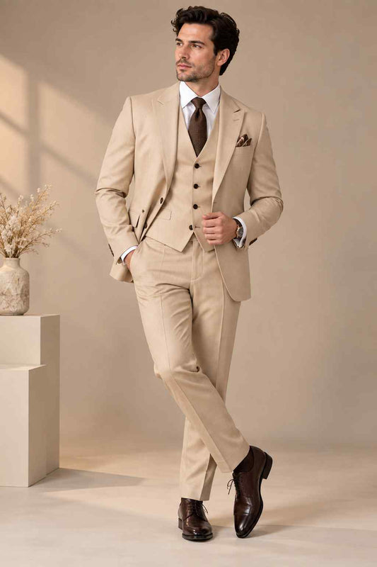 Men’s beige 3-piece suit with notch lapel jacket, matching waistcoat, tailored trousers, white shirt, brown tie and pocket square.