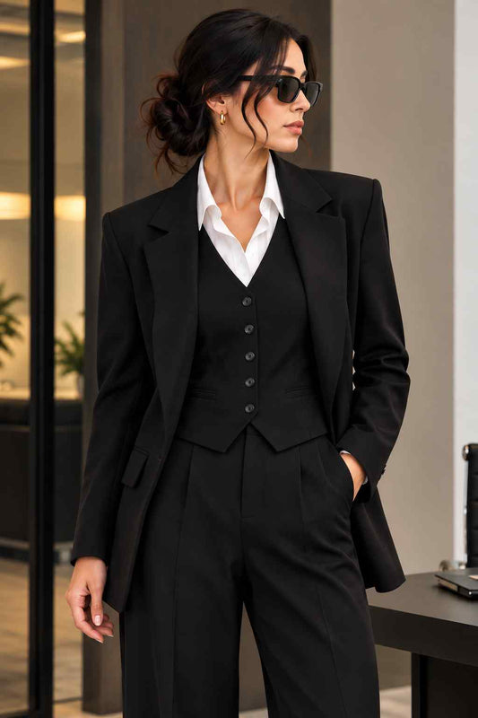 Women’s black 3-piece suit with peak lapel blazer, buttoned waistcoat and wide-leg trousers