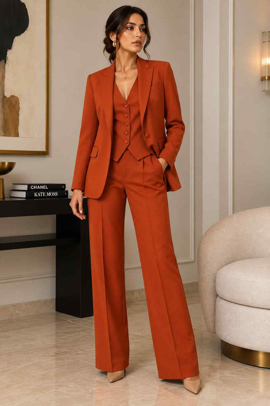 Women’s rust orange 3-piece suit with tailored blazer, matching waistcoat and wide-leg trousers