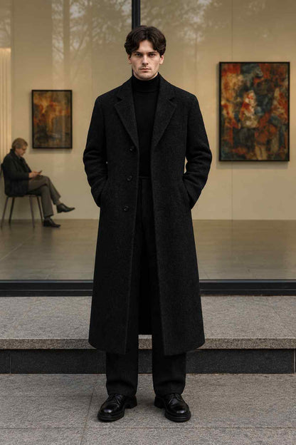Men’s black tweed wool long coat, vintage-style tailored winter overcoat with classic lapels and button closure.